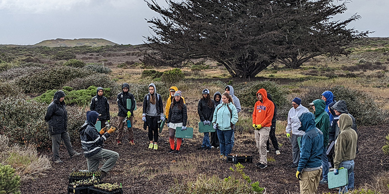 Volunteers listening to park staff at Fort Ord Dunes State Park