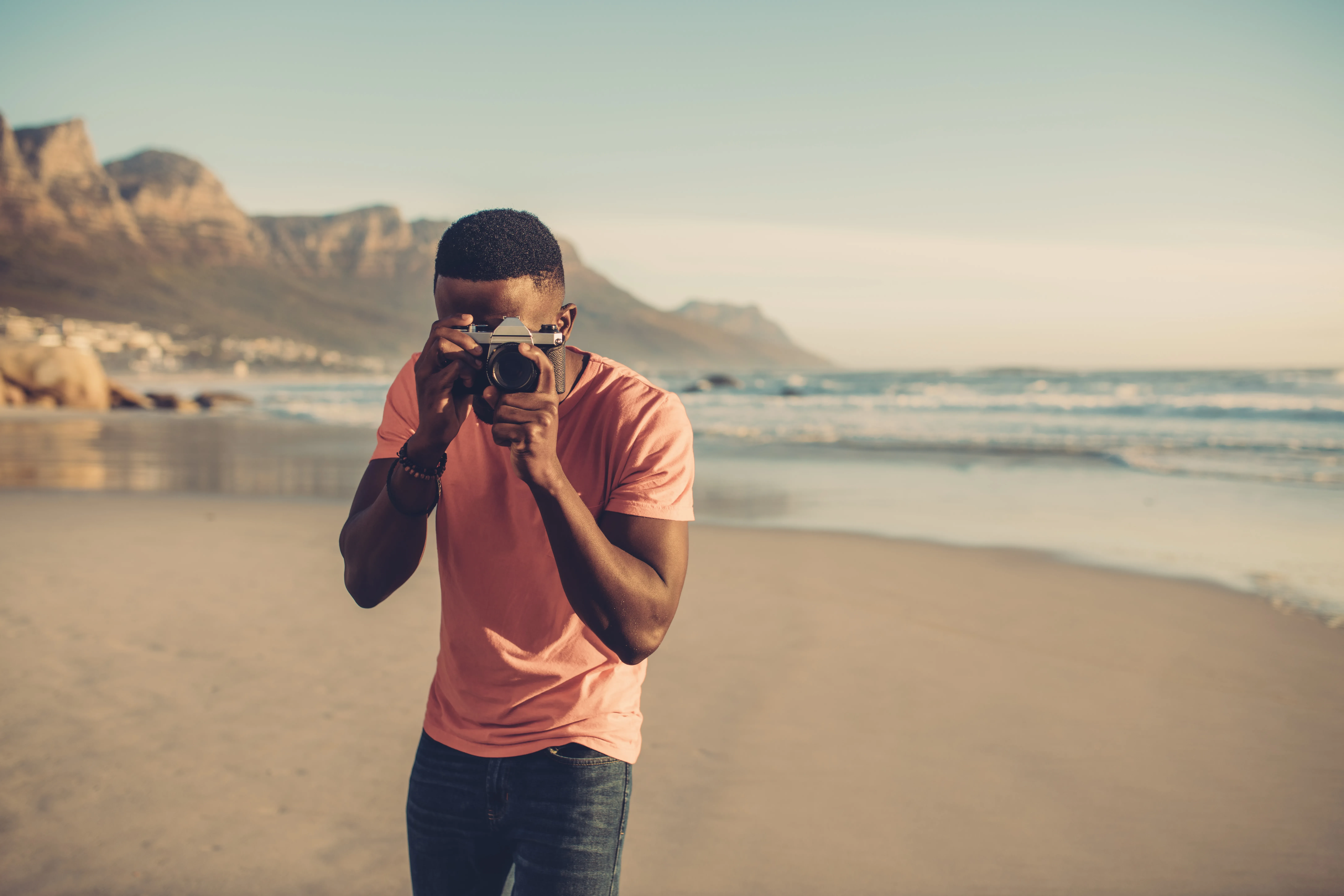 Man taking photo on beach