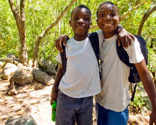 Two boys in wooded park