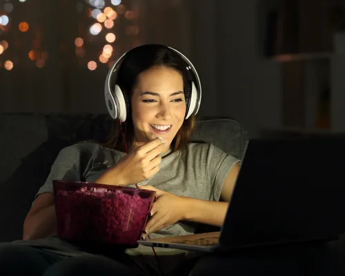 Woman watching movie on laptop
