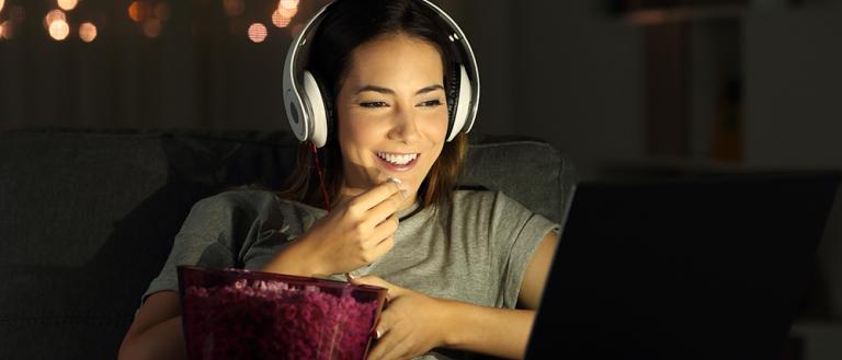 Woman watching movie on laptop
