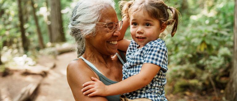 Older woman with female child on a trail