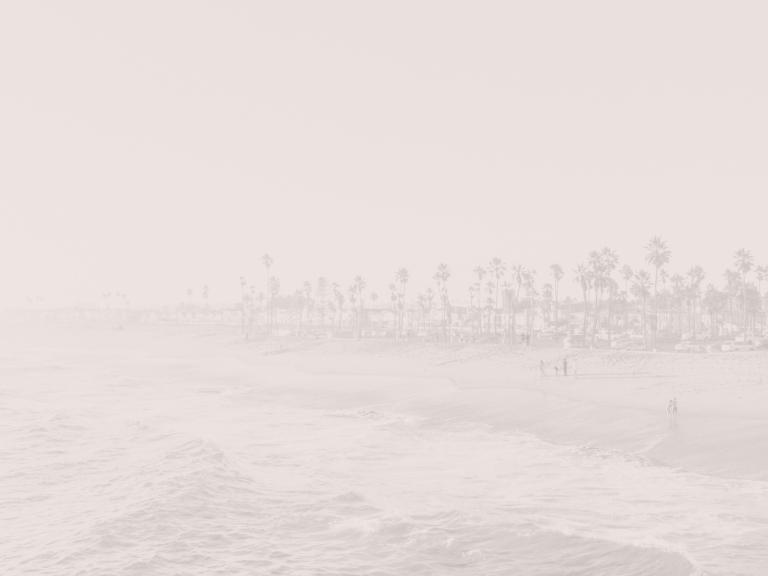 gently crashing waves at the beach shore during mid day
