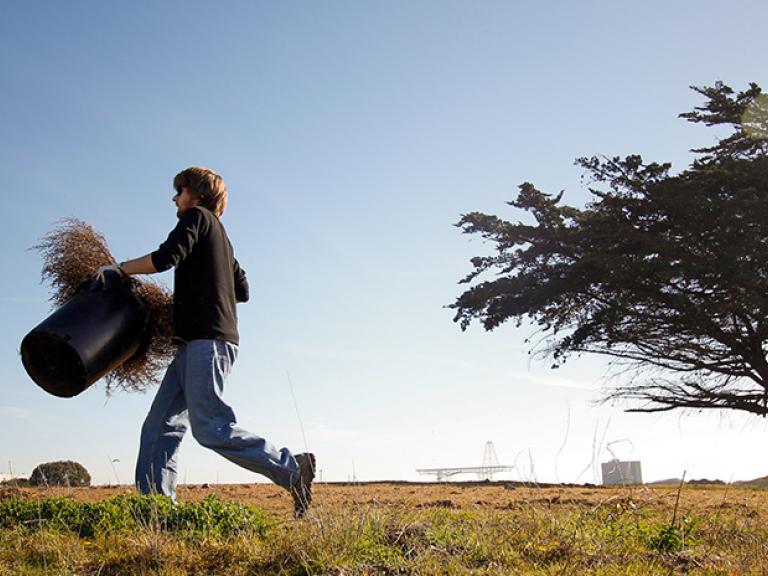 Volunteer at Candlestick carrying vital supplies