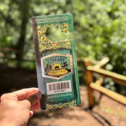 Person holding California Library Park Pass at Samuel P Taylor State Park