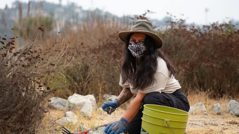 Woman wearing mask volunteering Chino Hills State Park