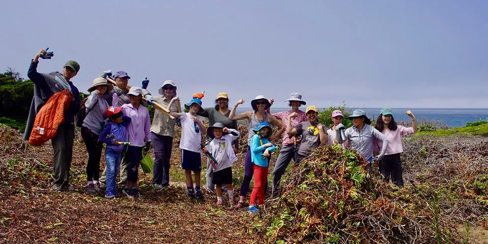 A group of happy volunteers at Half Moon Bay State Beach