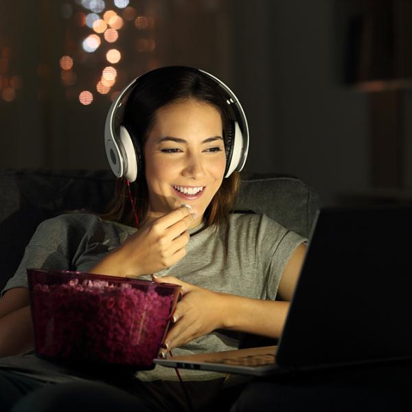 Woman watching movie on laptop