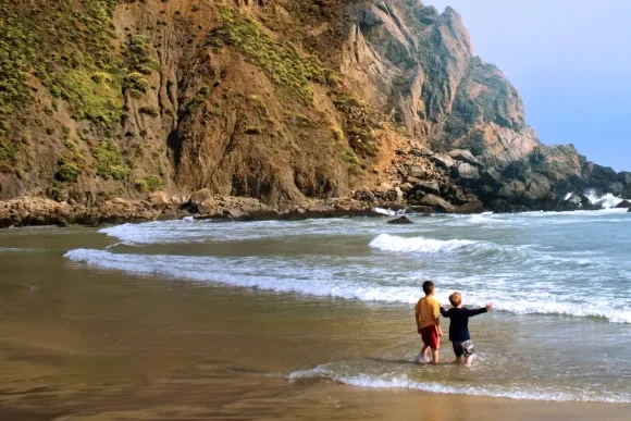 Two youth on beach